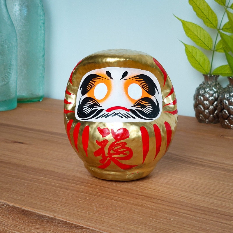 Stor gyllene Daruma 12 och 15 cm
