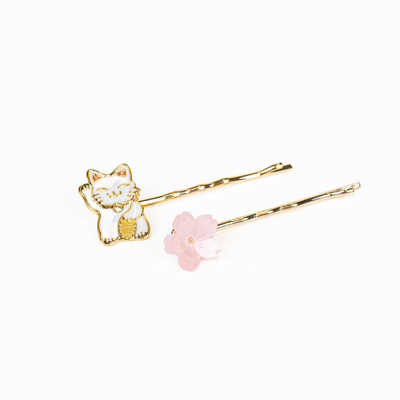 Japanska hårspännen med Maneki-Neko och Sakura-motiv