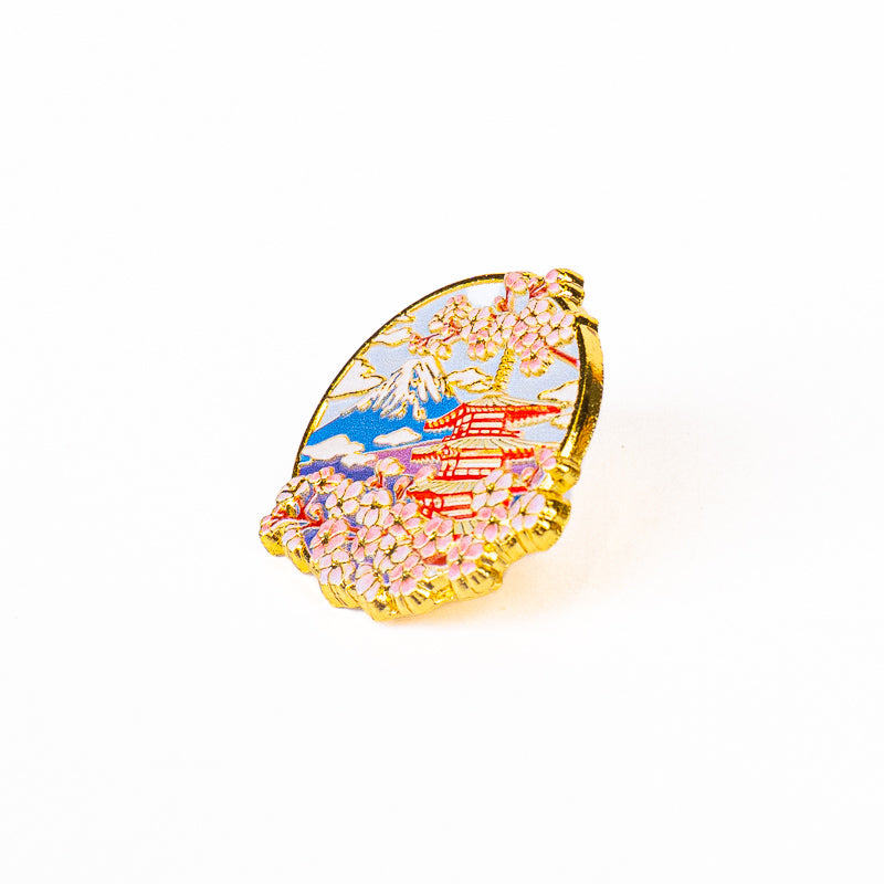 Japanska metallpins med motiv av tempel Fuji och sakura