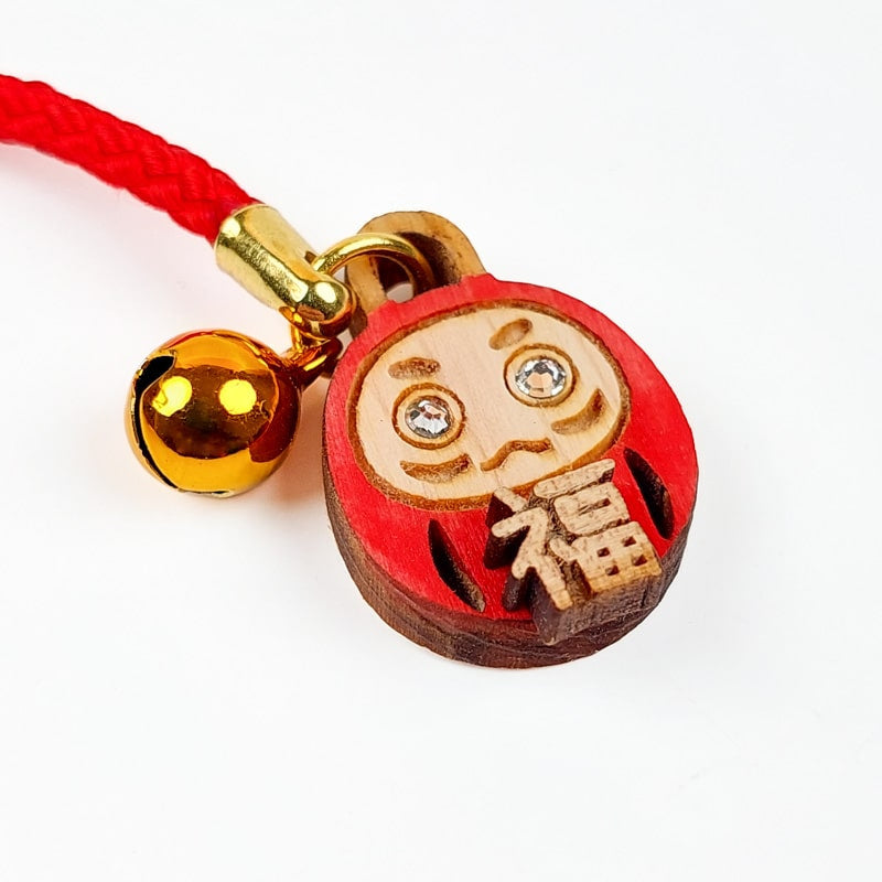 Nyckelring i Daruma trä