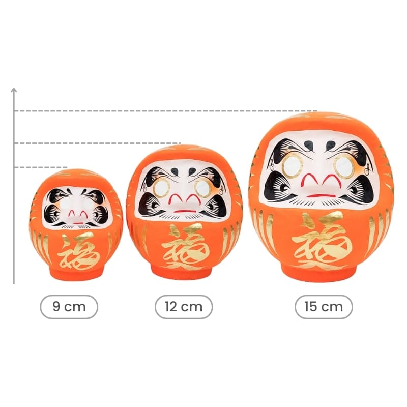 Orange japansk Daruma 9 till 15 cm