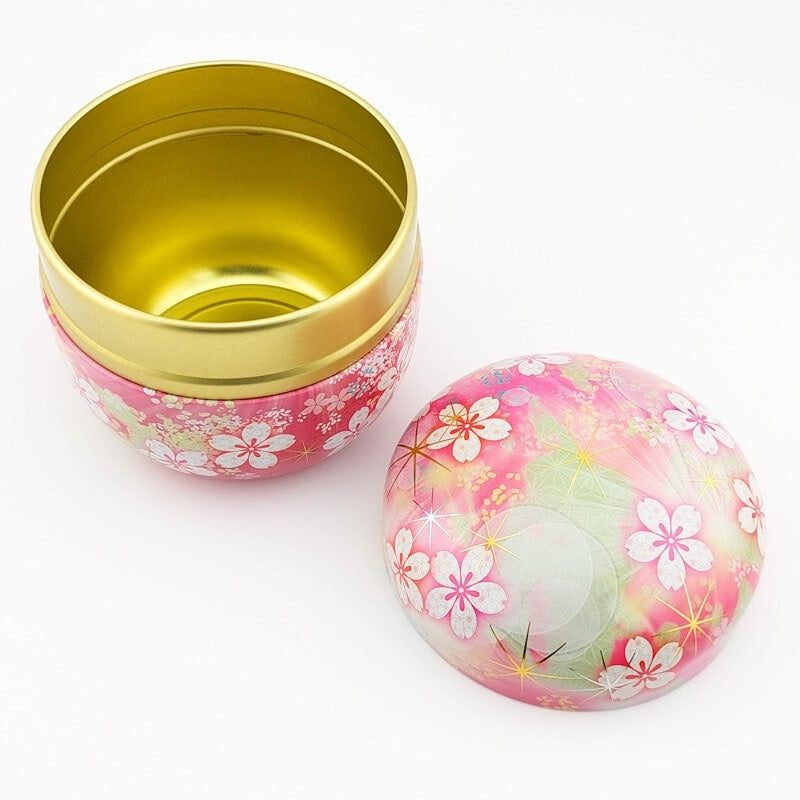 Teask i metall med rosa blommor